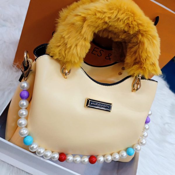 beautiful bag , long strap , adjustable pearls front look and with furr soft handle 144799